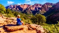 Senior woman enjoying the view of the Red Rock Mountains of the Kolob Canyon part of Zion National Park, Utah