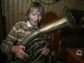 Senior woman is playing on a horn Royalty Free Stock Photo