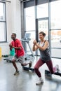 Senior woman exercising with aerobic steps