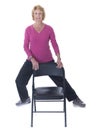 Senior woman exercising with chair