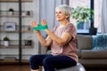 senior woman exercising with elastic band at home Royalty Free Stock Photo