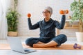 Senior woman exercising at home Royalty Free Stock Photo