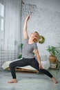 Senior woman exercising home, the concept of a healthy lifestyle, fitness and yoga Royalty Free Stock Photo