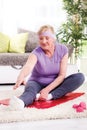 Senior woman exercising in home gym Royalty Free Stock Photo