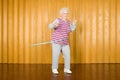 Senior woman exercising with a hula hoop Royalty Free Stock Photo