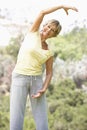 Senior Woman Exercising In Park Royalty Free Stock Photo