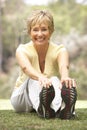 Senior Woman Exercising In Park