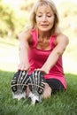 Senior Woman Exercising In Park Royalty Free Stock Photo