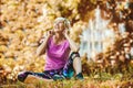 Senior active woman exercising in park while listening to music Royalty Free Stock Photo