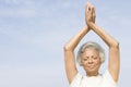 Senior Woman With Eyes Closed In Yoga Pose