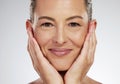 Senior woman, face and skincare smile for beauty touching soft and smooth skin on a studio background. Closeup portrait Royalty Free Stock Photo