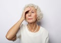 Senior woman feeling blue worried about problems, pensive upset sad middle aged grey haired lady