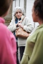 Senior Woman Feeling Intimidated By Teenage Girls