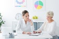 Senior woman filling medical information Royalty Free Stock Photo