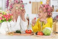 Senior woman and girl with pink hair curlers on head Royalty Free Stock Photo