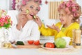 Senior woman and girl with pink hair curlers on head Royalty Free Stock Photo