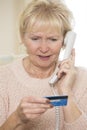 Senior Woman Giving Credit Card Details On The Phone Royalty Free Stock Photo