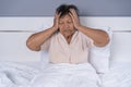 Senior woman got a headache on bed Royalty Free Stock Photo