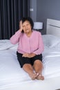 Senior woman got a headache on bed Royalty Free Stock Photo