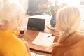 Senior woman with granddaughter using tablet Royalty Free Stock Photo