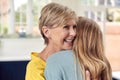 Senior Woman Greeting And Hugging Grown Up Adult Daughter At Home Royalty Free Stock Photo