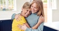 Senior Woman Greeting And Hugging Grown Up Adult Daughter At Home Royalty Free Stock Photo