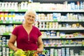 Senior woman in groceries store Royalty Free Stock Photo