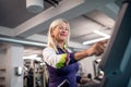 A senior woman in gym doing cardio work out exercise. Royalty Free Stock Photo