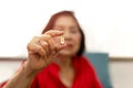 Senior woman hand holding vitamin fish oil health care