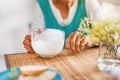 Senior woman hands holding big cup of yogurt. Old woman holding a glass of milk, health care concept, wrinkled skin, no Royalty Free Stock Photo