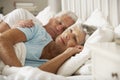 Senior Woman Having Difficulty In Sleeping In Bed With Husband Royalty Free Stock Photo
