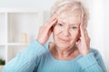 Senior woman having headache Royalty Free Stock Photo