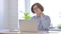 Senior Woman having Neck Pain while using Laptop Royalty Free Stock Photo