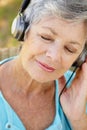 Senior woman with headphone Royalty Free Stock Photo