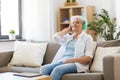 Senior woman in headphones listening to music Royalty Free Stock Photo