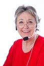 Senior woman with headset - elder woman isolated on white background Royalty Free Stock Photo