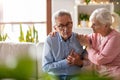 Senior woman helping her husband with chest pain Royalty Free Stock Photo