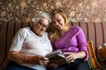 Granny showing her granddaughter memories from the past Royalty Free Stock Photo