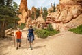Senior woman and her grandson hiking together in Bryce Canyon National Park, Utah, USA looking out at a scenic view Royalty Free Stock Photo