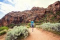 Senior Woman hiking in a beautiful red rock canyon Royalty Free Stock Photo