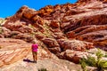 Senior woman hiking on the Red Sandstone Cliffs of the Calico Trail in Red Rock Canyon National Conservation Area near Las Vegas, Royalty Free Stock Photo