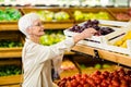 Senior woman holding bag with apple Royalty Free Stock Photo