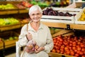 Senior woman holding bag with apple Royalty Free Stock Photo