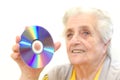 Senior woman holding dvd Royalty Free Stock Photo