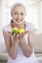 Senior Woman Holding Fruit