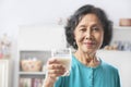 Senior woman holding glass of milk Royalty Free Stock Photo