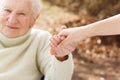 Senior woman holding hands with young lady Royalty Free Stock Photo