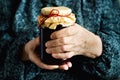 Senior woman holding jar of homemade cherry jam. Banner. Copy space. Royalty Free Stock Photo