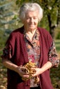 Senior woman holding leaves