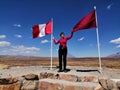 Senior woman holding Peruvian flag